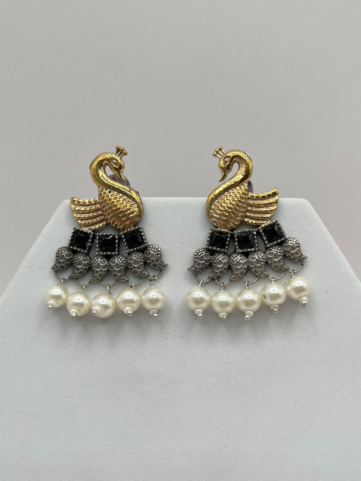 Vrishika Swan shape Black stone Dual Tone earrings