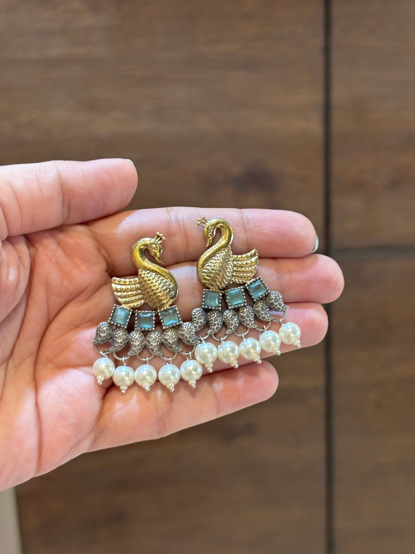 Vrishika Swan shape Green stone Dual Tone earrings