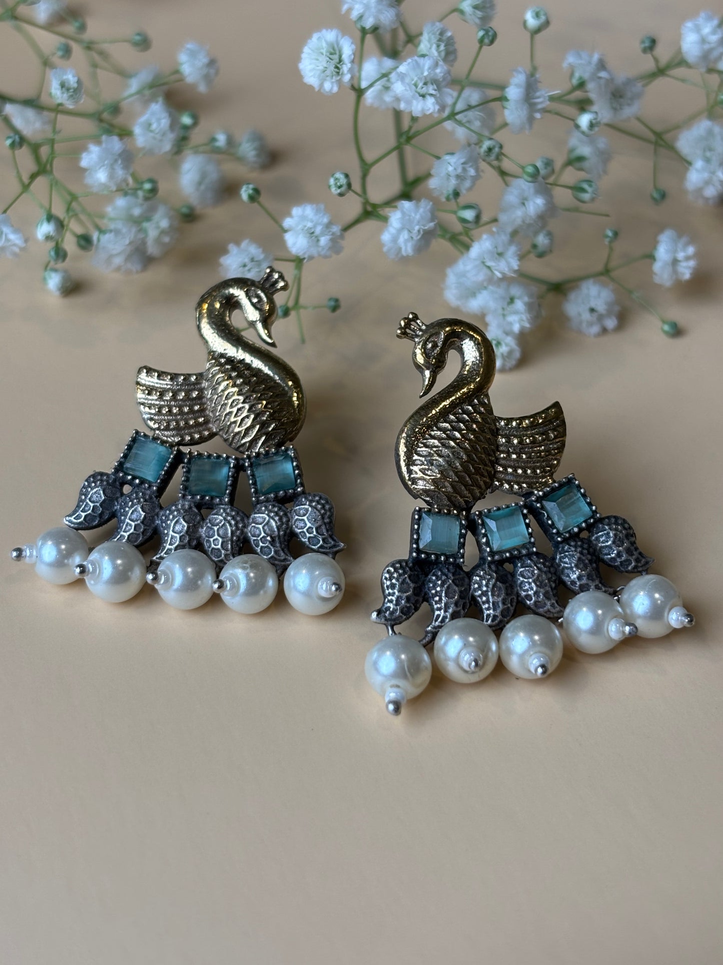 Vrishika Swan shape Green stone Dual Tone earrings